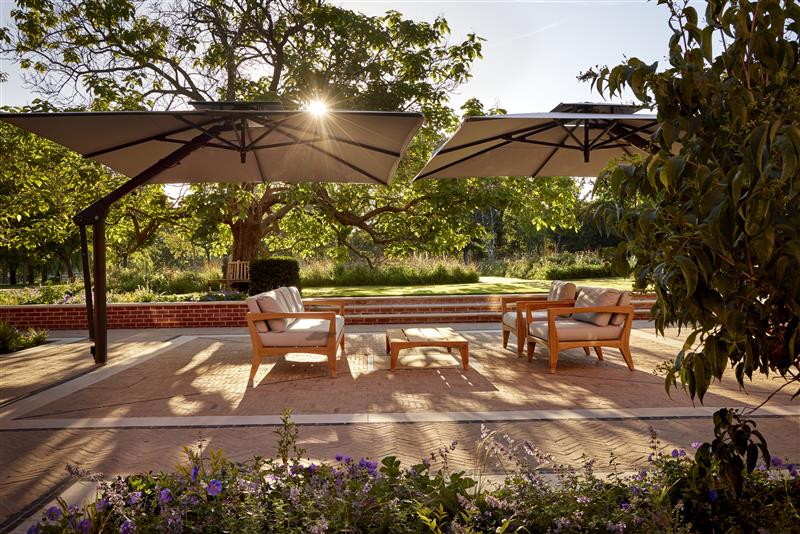 Rear patio seating under parasols 