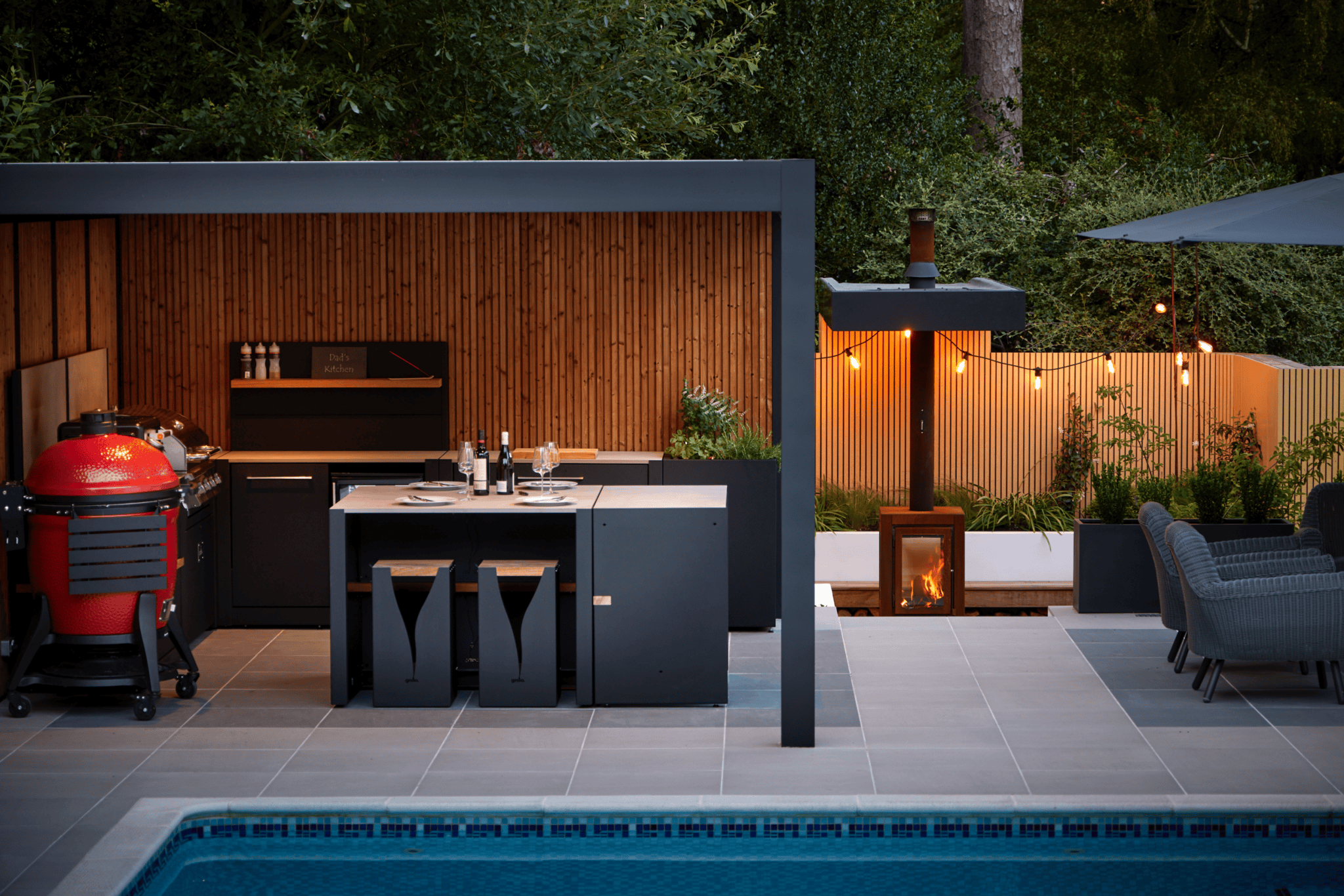 Outdoor kitchen with seating area 
