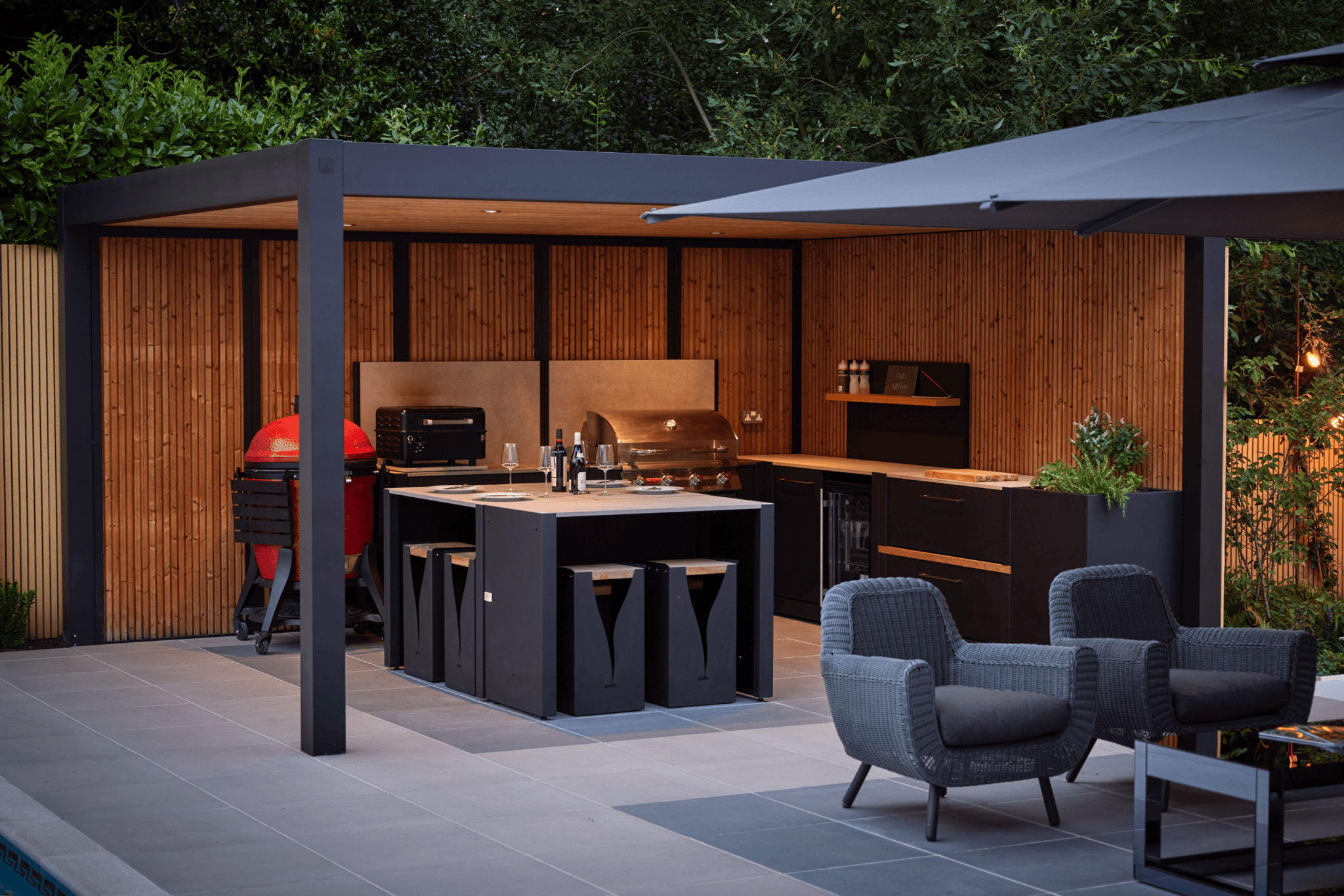 A well-planned outdoor kitchen should feel connected to the wider garden, not added as a separate feature.