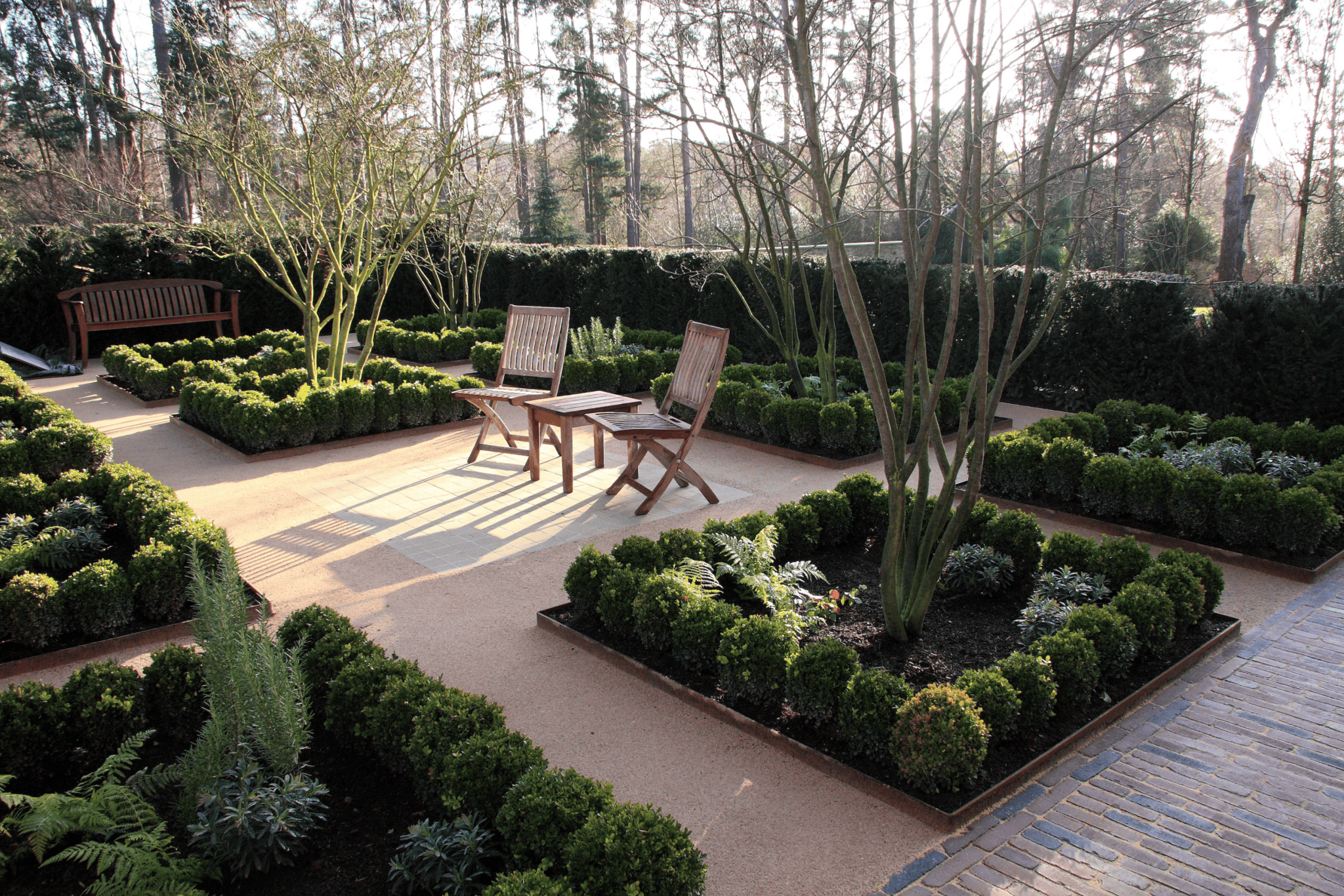 Seating area in between organised planting 