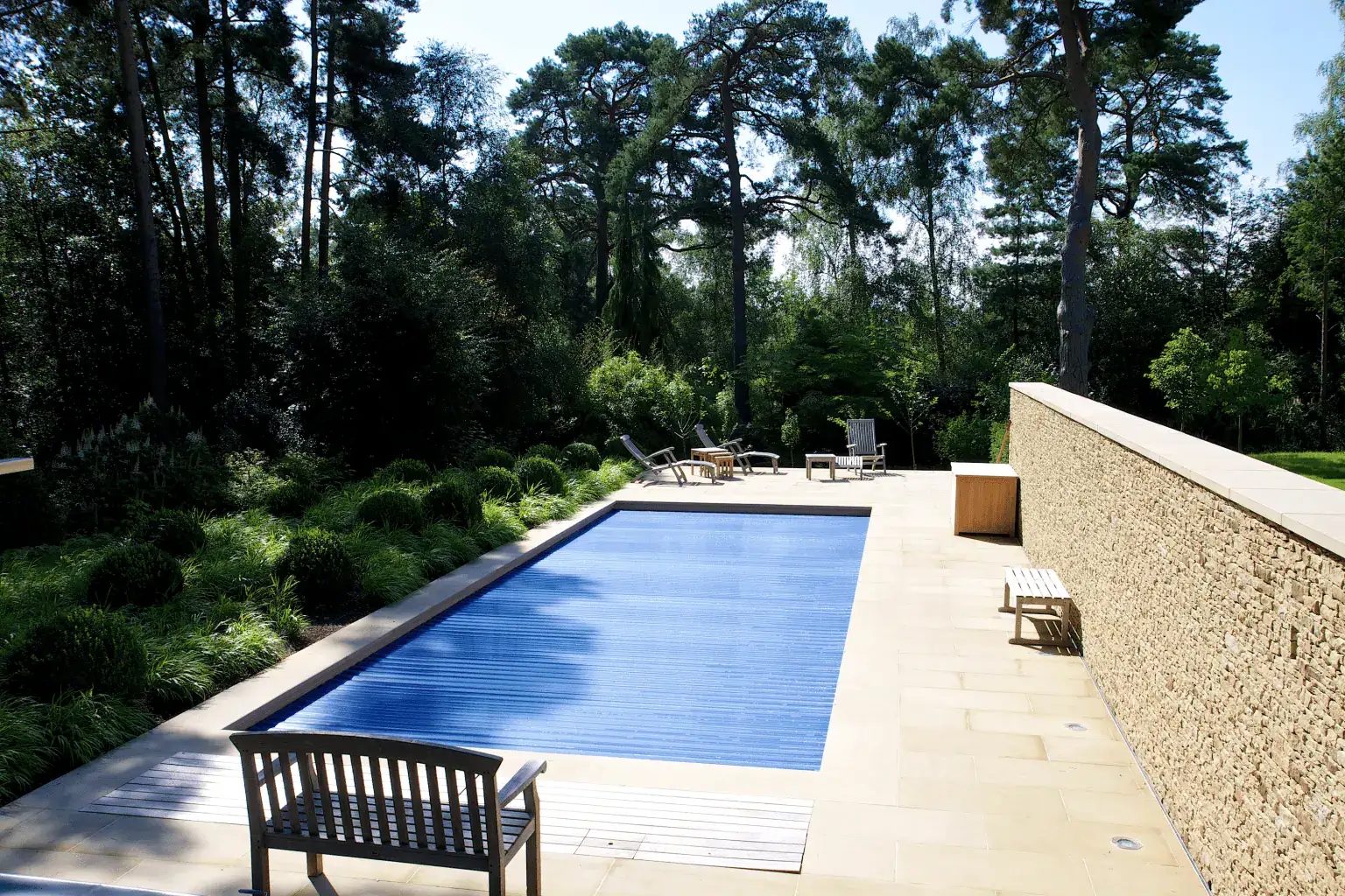 Plan pool covers, drainage and service access early so they do not disrupt the finished design.